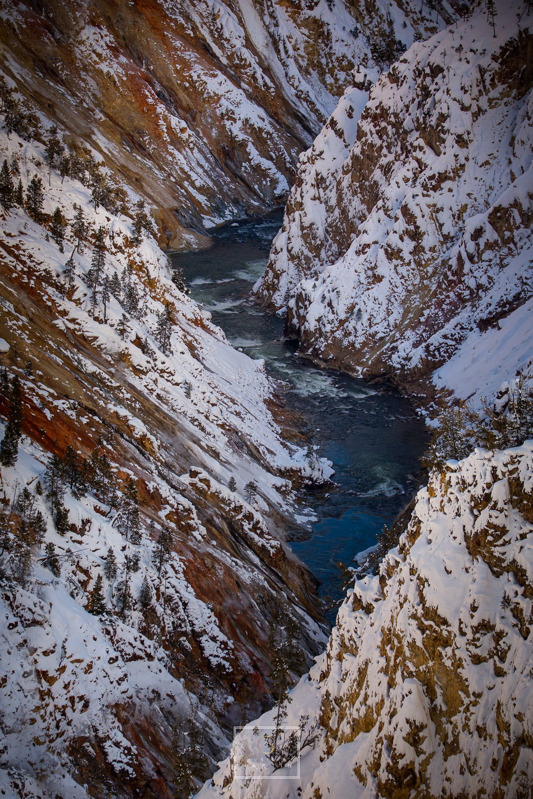 There is always something so beautiful when you have blue water next to snow. This is Canyon in Yellowstone shooting down into...